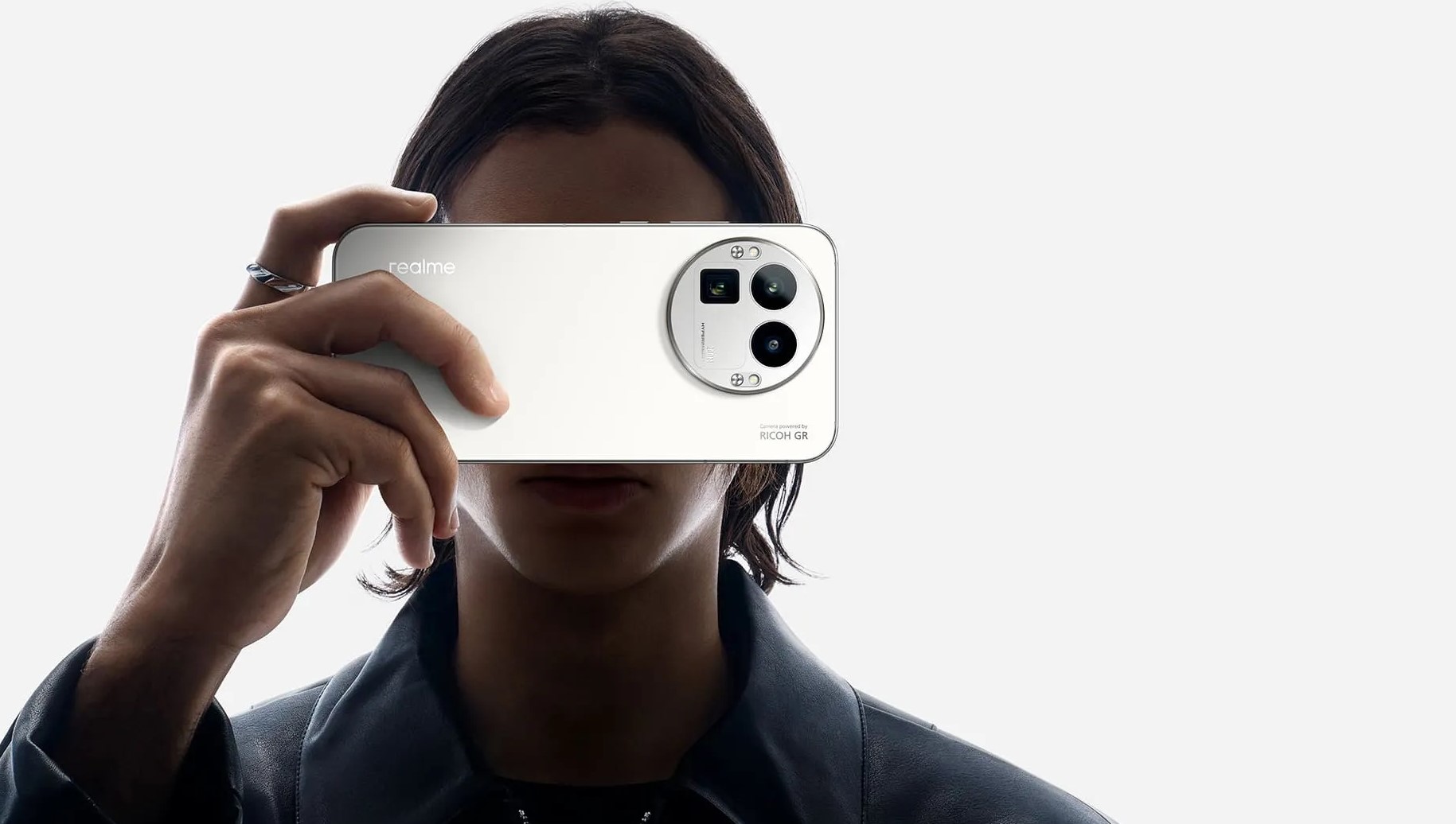 realme gt 8 pro phone held by a man